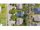 An overhead aerial view shows the roofs and yards of houses in a suburban neighborhood at 11651 Beardsley Way, Fishers, IN 46038