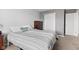 This bedroom features neutral walls, carpeted floors, and two doors at 11651 Beardsley Way, Fishers, IN 46038