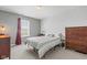 This bedroom features neutral walls, carpeted floors, and a window for natural light at 11651 Beardsley Way, Fishers, IN 46038