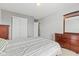 This bedroom features neutral walls, carpeted floors, two doors and a wood dresser at 11651 Beardsley Way, Fishers, IN 46038