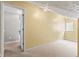 Bright bonus room with neutral walls, carpet, and natural light from the window at 11651 Beardsley Way, Fishers, IN 46038