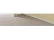 Close-up of beige carpet with white baseboards, showcasing the room's clean finish at 11651 Beardsley Way, Fishers, IN 46038