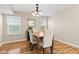 Cozy dining area featuring natural light, hardwood floors, and simple, elegant decor at 11651 Beardsley Way, Fishers, IN 46038