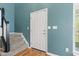 A bright entryway with hardwood floors and a staircase at 11651 Beardsley Way, Fishers, IN 46038