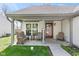 Cozy front porch featuring comfortable seating, a decorative wreath, and a welcoming ambiance at 11651 Beardsley Way, Fishers, IN 46038