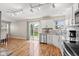 Modern kitchen with stainless steel appliances and light-filled dining area at 11651 Beardsley Way, Fishers, IN 46038