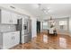 Open-concept kitchen featuring stainless steel appliances and connection to dining area at 11651 Beardsley Way, Fishers, IN 46038
