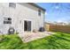 A patio with a grill and seating area offers outdoor enjoyment in the backyard at 11651 Beardsley Way, Fishers, IN 46038