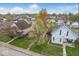 Aerial view of the property and surrounding neighborhood with well-maintained lawns and mature trees at 122 S 3Rd Ave, Beech Grove, IN 46107