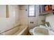 Modest bathroom featuring a tub/shower combination, toilet, and sink at 122 S 3Rd Ave, Beech Grove, IN 46107
