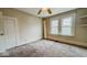 Cozy bedroom features natural light, ceiling fan, and carpet floors at 122 S 3Rd Ave, Beech Grove, IN 46107