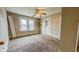 Cozy bedroom features natural light, ceiling fan, and carpet floors at 122 S 3Rd Ave, Beech Grove, IN 46107