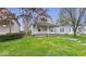 Charming two-story home with a gambrel roof and inviting front yard and porch at 122 S 3Rd Ave, Beech Grove, IN 46107