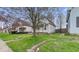 Charming two-story home with a gambrel roof and inviting front yard and porch at 122 S 3Rd Ave, Beech Grove, IN 46107
