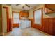 Functional laundry room features side-by-side washer and dryer hookups with tile floors at 122 S 3Rd Ave, Beech Grove, IN 46107