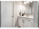Clean bathroom features a white vanity, modern mirror, and sleek fixtures, offering a refreshing space at 1242 Petit Verdot Dr, Westfield, IN 46074