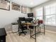 Home office features multiple monitors, natural light, and streamlined printer at 1242 Petit Verdot Dr, Westfield, IN 46074