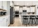 Modern kitchen with stainless steel appliances, quartz countertops, and white cabinetry at 1242 Petit Verdot Dr, Westfield, IN 46074