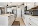 Bright kitchen showcases an island with white countertops and cabinetry, and stainless steel appliances at 1242 Petit Verdot Dr, Westfield, IN 46074