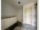 A bathroom with a modern white vanity, a clean shower, and sleek fixtures offering a functional design at 1319 Fleming Dr, Greenfield, IN 46140
