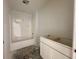 A bathroom with a new tub, a clean white vanity, and sleek fixtures offering a functional design at 1319 Fleming Dr, Greenfield, IN 46140