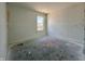 Bright, unfinished bedroom with a large window, ready for its final touches at 1319 Fleming Dr, Greenfield, IN 46140