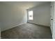 Clean bedroom featuring carpet floors, a window, and white walls at 1319 Fleming Dr, Greenfield, IN 46140