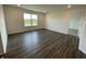 The bedroom features a large window for natural light and hardwood floors and an adjacent door into a closet at 1319 Fleming Dr, Greenfield, IN 46140