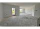 Bright living room with ample natural light, smooth walls, and a door leading to the outdoors at 1319 Fleming Dr, Greenfield, IN 46140