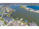 This aerial view shows homes along a lake with piers and boats. Some have pools and manicured lawns at 13705 Beam Ridge Dr, McCordsville, IN 46055