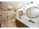 Bathroom with dual sink vanity, wood cabinets, quartz countertop, a frameless glass shower with tile surround at 13705 Beam Ridge Dr, McCordsville, IN 46055