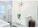 Relaxing bathroom with standalone tub, glass enclosed shower, and a modern chandelier above the tub at 13705 Beam Ridge Dr, McCordsville, IN 46055