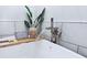 Close-up of modern bathtub with stylish fixtures and decor at 13705 Beam Ridge Dr, McCordsville, IN 46055