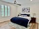 Cozy bedroom with natural light, a ceiling fan, an area rug, and a comfortable bed adorned with tasteful decor at 13705 Beam Ridge Dr, McCordsville, IN 46055
