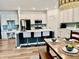 Bright, modern kitchen with an island offering seating, sleek countertops, and state-of-the-art stainless steel appliances at 13705 Beam Ridge Dr, McCordsville, IN 46055