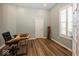Home office with hard wood flooring, natural wood desk and ample lighting at 13705 Beam Ridge Dr, McCordsville, IN 46055