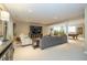 Finished basement featuring a large seating area with tv, and a billiards table perfect for entertaining at 14491 Jeremy Dr, Carmel, IN 46033