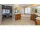 Spacious bathroom showcasing a soaking tub, vanity, and bedroom view at 14491 Jeremy Dr, Carmel, IN 46033
