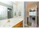 Well-lit bathroom featuring a vanity and connecting bedroom view at 14491 Jeremy Dr, Carmel, IN 46033