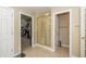 Bright bathroom with a glass enclosed shower and walk-in closet access at 14491 Jeremy Dr, Carmel, IN 46033