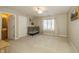 Neutral bedroom with a ceiling fan and a connecting bathroom at 14491 Jeremy Dr, Carmel, IN 46033