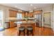 Bright kitchen boasts granite countertops, stainless appliances and a large center island with seating at 14491 Jeremy Dr, Carmel, IN 46033