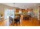 Spacious kitchen with wood floors, ample cabinetry, granite counters, stainless appliances and a large kitchen island at 14491 Jeremy Dr, Carmel, IN 46033