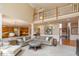 Open-concept living room with a fireplace, lots of natural light, and easy access to the kitchen for seamless entertaining at 14491 Jeremy Dr, Carmel, IN 46033