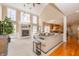 Bright and airy living room with a fireplace, high ceilings, and seamless flow to the kitchen for modern living at 14491 Jeremy Dr, Carmel, IN 46033