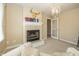 Inviting living room features a decorative fireplace and elegant chandelier lighting at 14491 Jeremy Dr, Carmel, IN 46033
