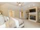 Large main bedroom with fireplace, soft carpet, and french doors at 14491 Jeremy Dr, Carmel, IN 46033