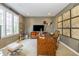 Charming home office with custom wood desk, vintage accents, and a tranquil view of the outdoors at 14491 Jeremy Dr, Carmel, IN 46033