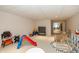 Bright and airy playroom featuring a cozy seating area, toys, and play structures for children to enjoy at 14491 Jeremy Dr, Carmel, IN 46033