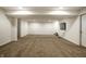 Finished basement with carpeting, recessed lighting, and a tv mounted on the wall with staircase and doors at 15144 Bentfield Ct, Fishers, IN 46037